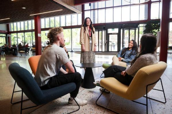 staff member talking to students